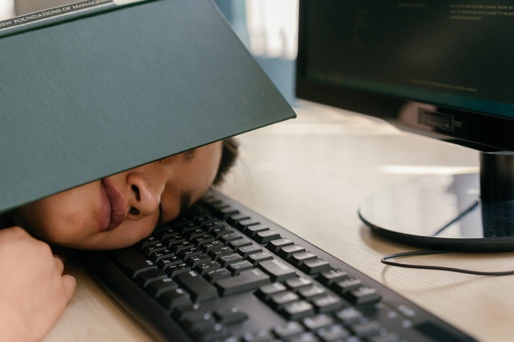 developer sleeping to show benefit of ai software development tools