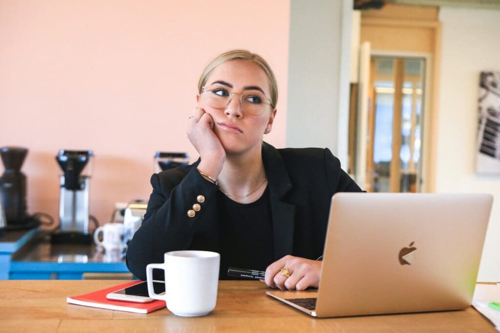 bored office worker on desktop as an example of typical crm use which is pc and not mobile