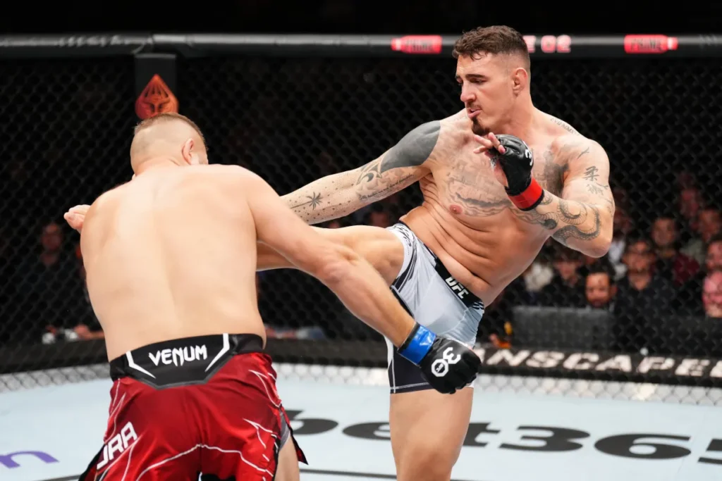 photo of mma fighter kicking as a humorous reference to app maintenance costs kicking in which should be factored in when estimating roi
