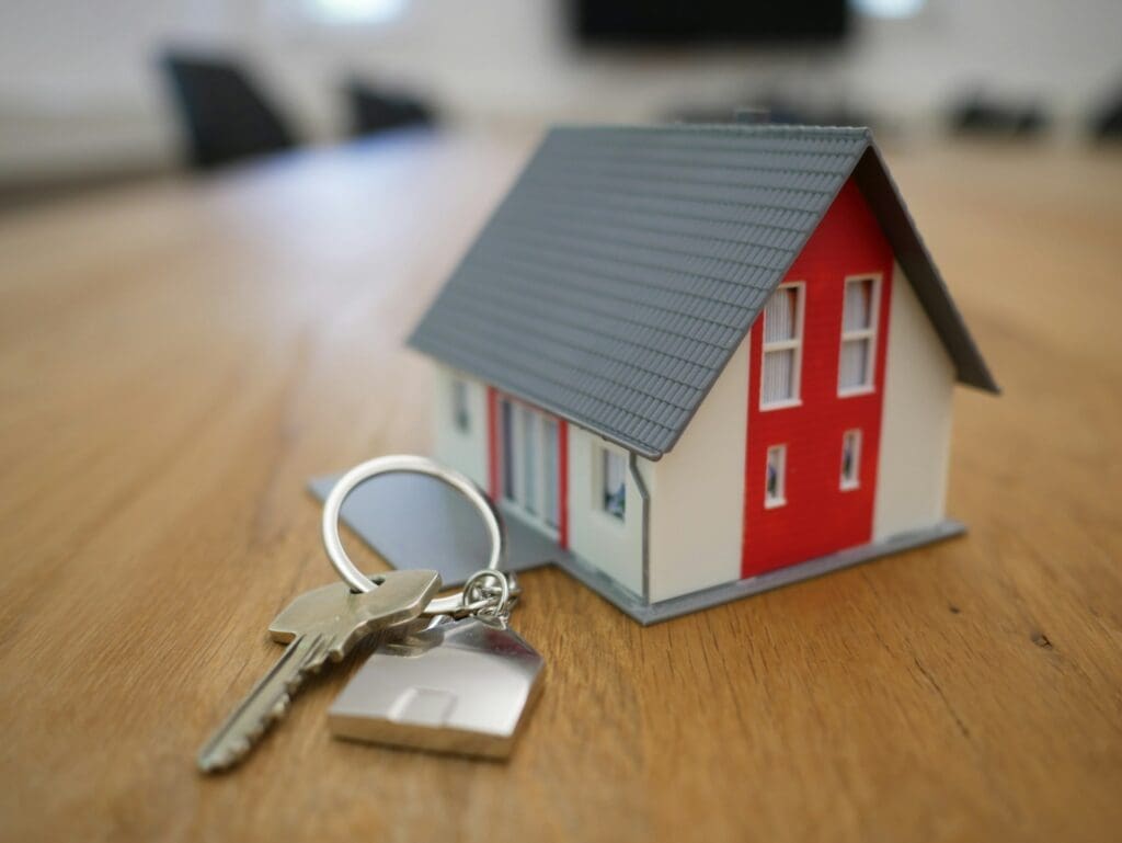 picture of house and keys to represent property development company which can benefit from custom real estate crm development
